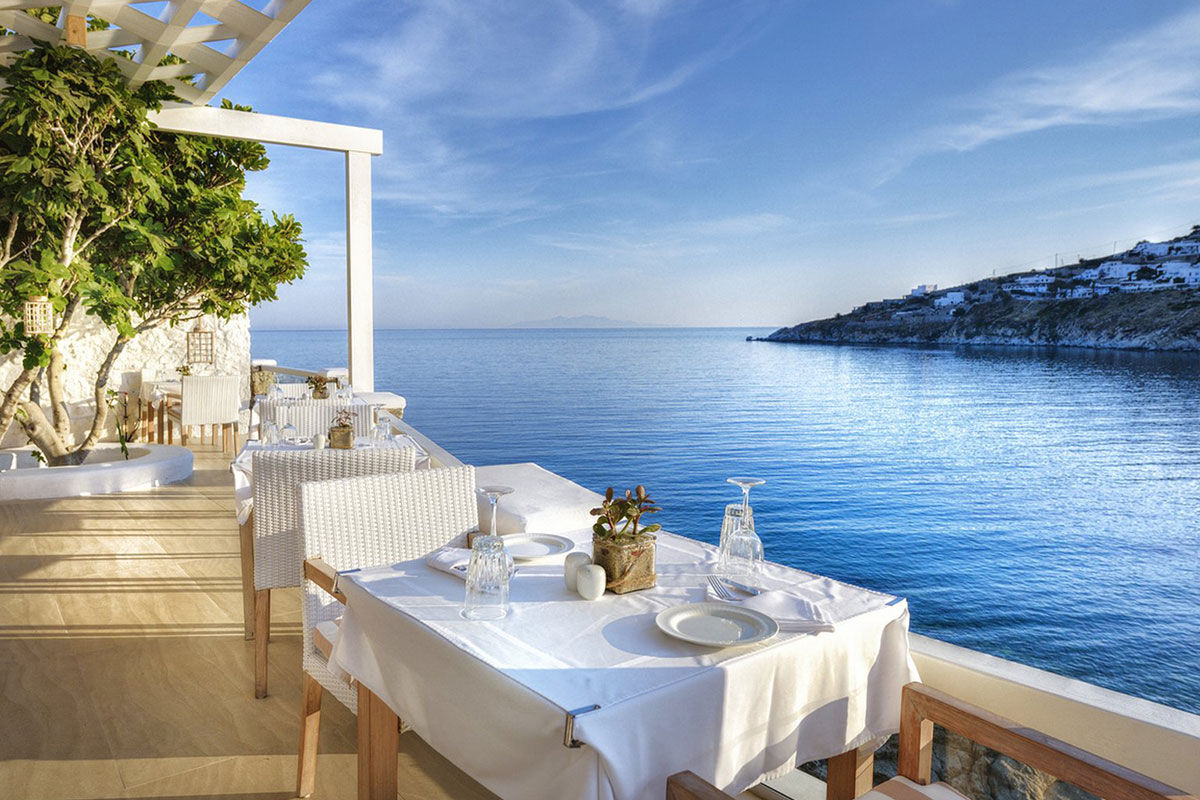 <b>Nissaki, Platis Yialos</b> - Surrounded by golden sunlight and clear blue waters, this luxury boutique hotel is set in traditional whitewashed buildings and features clean, streamline furnishings. Guests dine next to the Aegean Sea, swim in one of two pools with sun loungers nearby, and are only steps away from the renowned Platis Yialos Beach.