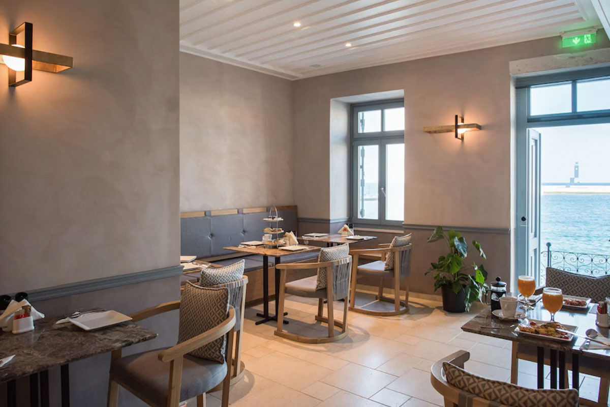 <b>Scala de Faro, Chania</b> - Located right on the Venetian harbor of Chania, this luxury boutique hotel has a sleek, contemporary style, with brass notes and warm coloring. Right in the middle of Old Town, guests have the cobblestone shopping street right outside their door.