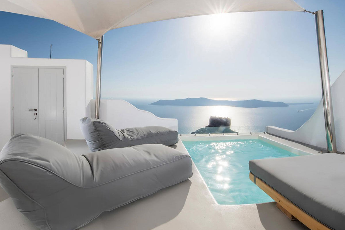 <b>Sunny Villas, Imerovigli</b> - With breathtaking views of the Aegean Sea, this relaxed hotel offers bright and airy accommodations with a pool and adjoining bar. With only a 5-minute walk to Skaros Rock, guests can venture out on the hillside and admire the white-washed village of Imerovigli, or walk further into the town of Thira.