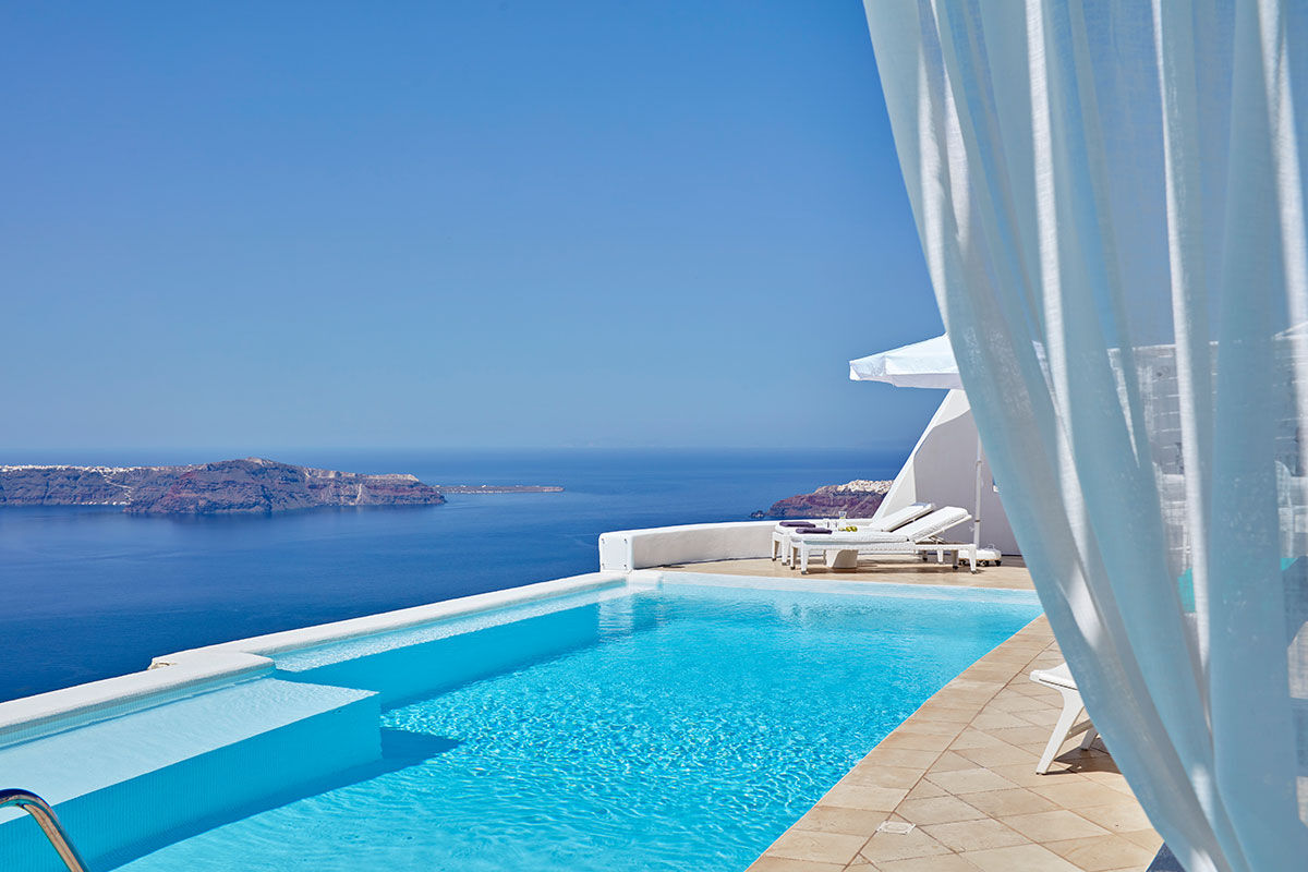 <b>Astra Suites, Imerovigli</b> - Set high on top of volcanic cliffs by the edge of the peaceful village Imerovigli, this all-suite hotel is contemporary and welcoming. Offering an infinity pool, romantic dining experiences and a spa area with a massage room, this picturesque complex helps guests enjoy life’s simple pleasures.