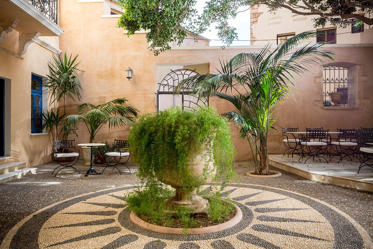 <b>Casa Delfino, Chania</b> - Housed within a 17th century Venetian mansion, this family-run boutique hotel has charm, class and a stunning courtyard with pebbled mosaics. Guests can enjoy a serene spa, rooftop garden or 7-minute walk to the Old Venetian Harbor.