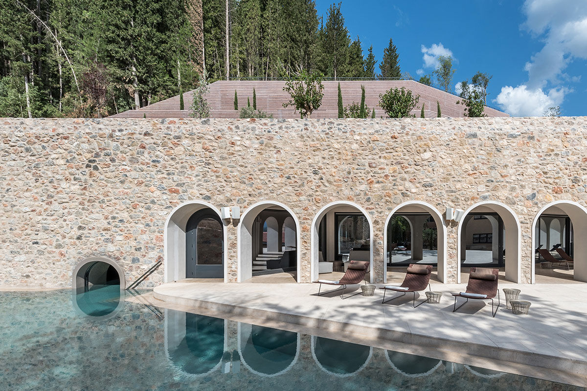 <b>Euphoria Retreat, Mystras</b> - Nestled in the hills of the Peloponnese peninsula, the Euphoria Retreat is a holistic wellbeing spa featuring an infinity pool, sphere pool and views of the mythical mountains. With earthy colors and a modern design scheme, this retreat center finds balance with nature and ancient medicine.