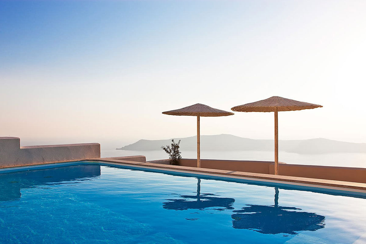 <b>Gold Suites, Imerovigli</b> - Located on the cliffside overlooking the Santorini Caldera, the Gold Suites offer spacious suites with a little glam. The infinity pool, poolside bar and open-air restaurant all face the Aegean Sea — and yet, you certainly will never tire of these views.