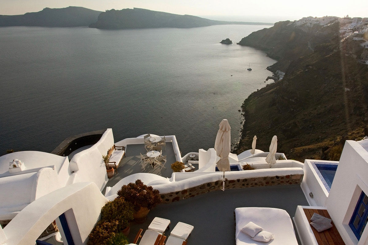 <b>Ikies Traditional Houses, Oia</b> - Comprised of 11 romantic guesthouses, Ikies is the perfect getaway for couples to relax and enjoy views of the Caldera and volcano. All suites have terraces, and their services department can help arrange sailing excursions, scuba diving or sight-seeing tours.