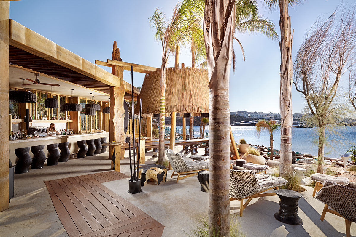 <b>Kensho, Psarou</b> - Nestled on Psarou Beach, Kensho is a clean, minimalist hotel with aged wood and stone trimmings. Rooms are contemporary and spacious, and guests can mingle at the poolside bar and restaurant with views of the crystal blue sea.