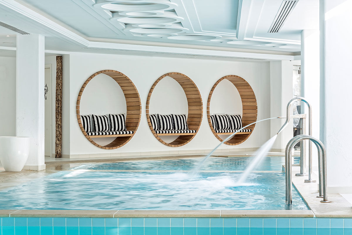 <b>Myconian Villa Collection, Elia</b> - Overlooking Elia Beach from its hillside perch, the Myconian Villa Collection offers luxurious rooms in a minimal Cycladic style with views of the Aegean Sea. Polished and contemporary, this hotel features an infinity pool, poolside bar and a fine dining restaurant right on the sundeck.