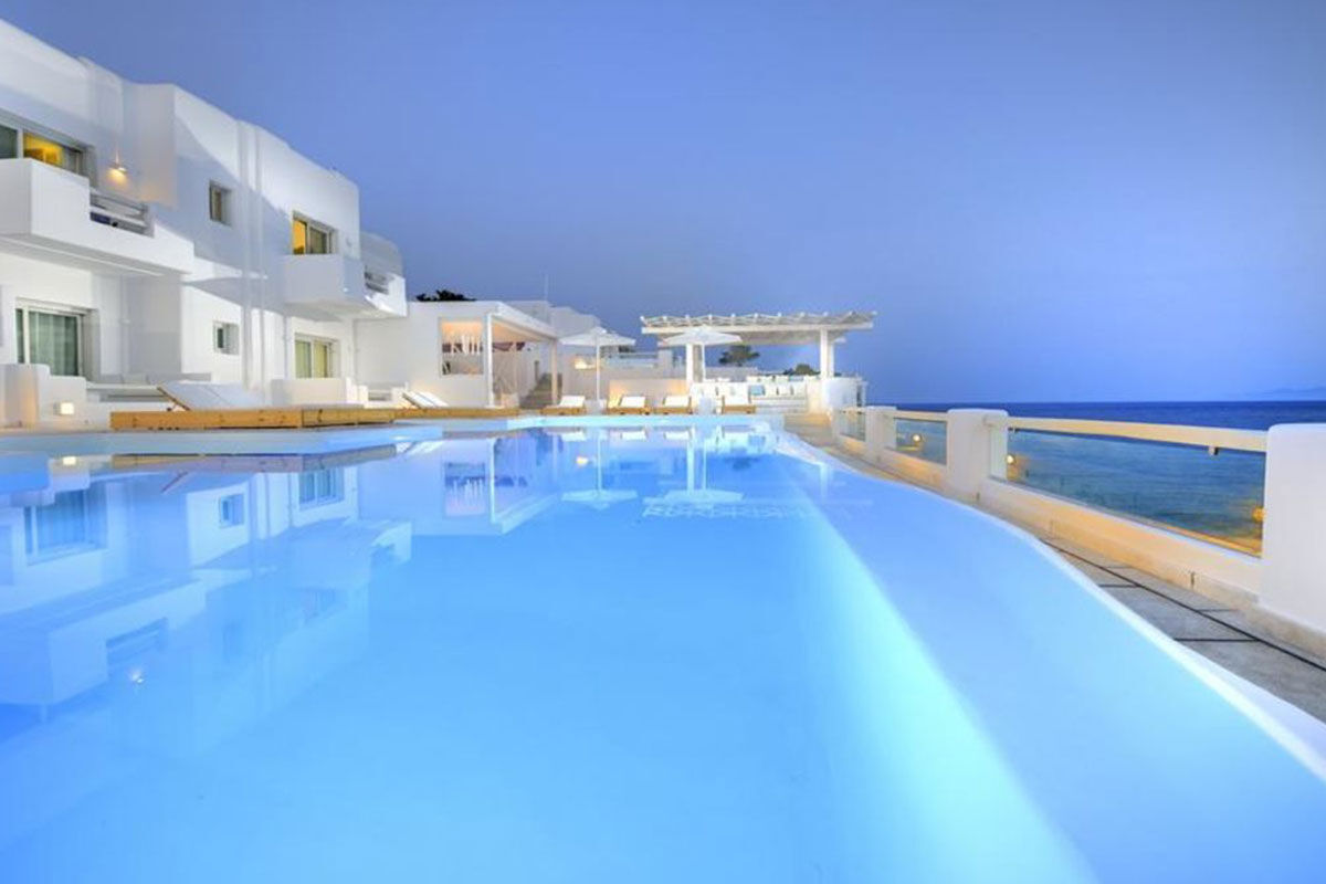 <b>Nissaki, Platis Yialos</b> - Surrounded by golden sunlight and clear blue waters, this luxury boutique hotel is set in traditional whitewashed buildings and features clean, streamline furnishings. Guests dine next to the Aegean Sea, swim in one of two pools with sun loungers nearby, and are only steps away from the renowned Platis Yialos Beach.