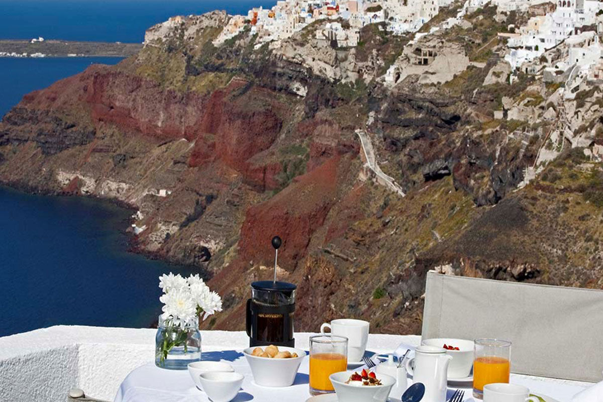 <b>Ikies Traditional Houses, Oia</b> - Comprised of 11 romantic guesthouses, Ikies is the perfect getaway for couples to relax and enjoy views of the Caldera and volcano. All suites have terraces, and their services department can help arrange sailing excursions, scuba diving or sight-seeing tours.