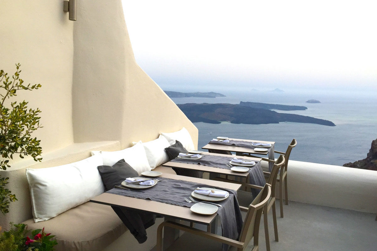 <b>Kapari Natural Resort, Imerovigli</b> - Housed in a 300-year-old Cycladic building, Kapari is an upscale hotel with minimalist décor and caldera views. Only a 30-minute scenic stroll to the hustle and bustle of Thira, Kapari is a tranquil retreat with a rooftop pool and fine dining restaurant/bar.