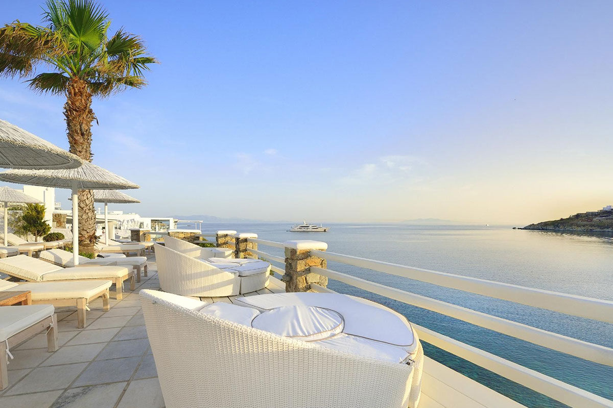 <b>Nissaki, Platis Yialos</b> - Surrounded by golden sunlight and clear blue waters, this luxury boutique hotel is set in traditional whitewashed buildings and features clean, streamline furnishings. Guests dine next to the Aegean Sea, swim in one of two pools with sun loungers nearby, and are only steps away from the renowned Platis Yialos Beach.