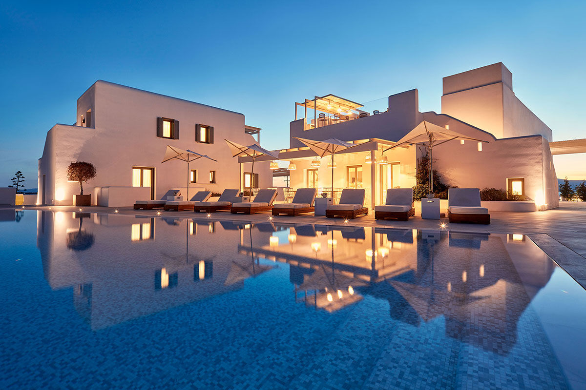 <b>18 Grapes, Agios Prokopios</b> – Within walking distance to Agios Prokopios beach, the 18 Grapes Hotel hints of Cycladic features amidst comfortable design. With a care-free island vibe, yet an attention to detail, this modern resort has everything you need: a two-level pool with lounge decks, sophisticated roof terrace, and the Grape Sunset bar restaurant.