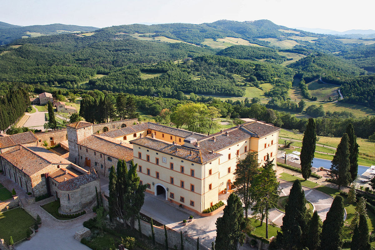 <b>Belmond Castello di Casole</b> - At this 10th century estate, wander the 4,200 acres of golden Tuscan countryside, relax in the wine cellar-turned-spacious spa or enjoy the valley-facing infinity pool. Surrounded by vineyards and olive groves, the Castello di Casole uses its panoramic views to inspire the rich traditional décor within.