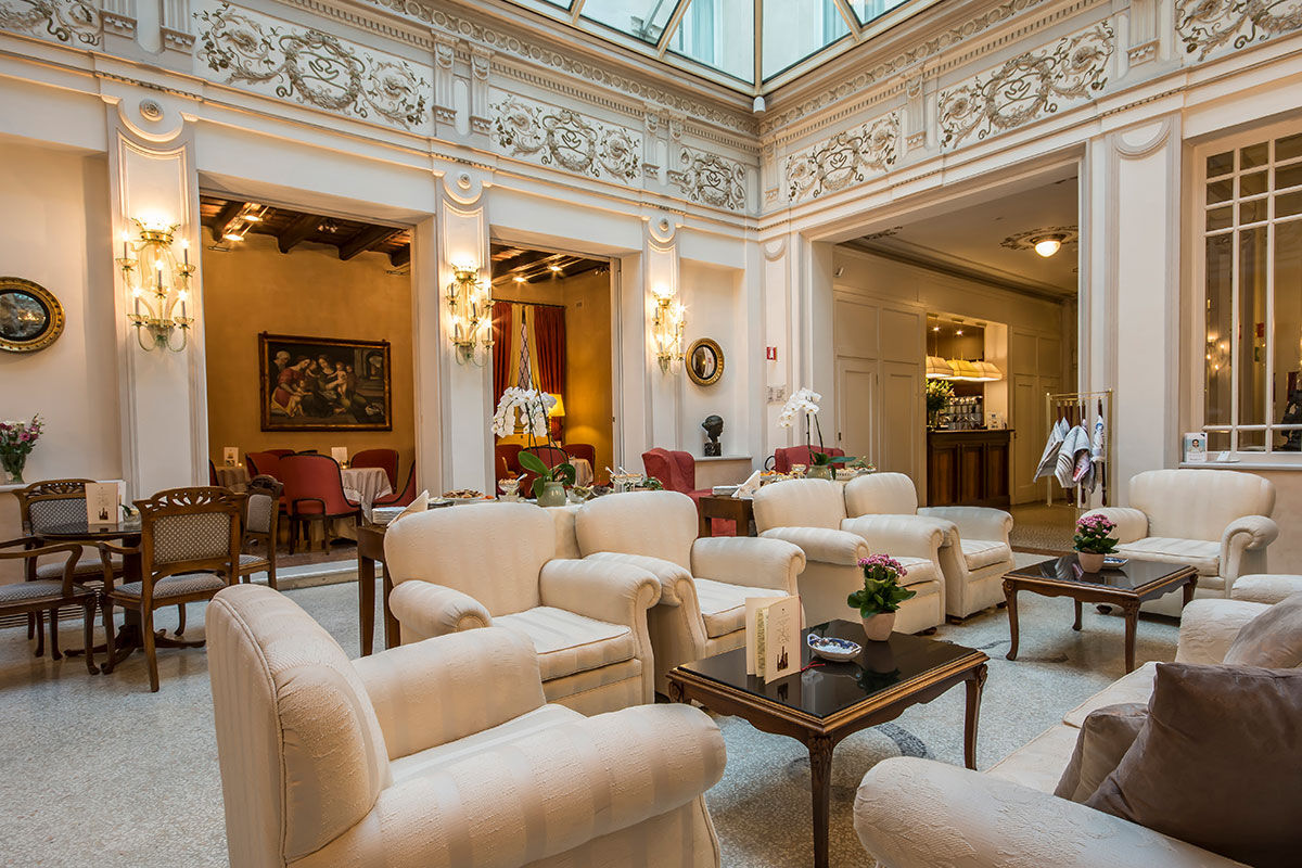 <b>Hotel Corona D'Oro, Bologna</b> - Housed in a 13th century redbrick building, this elegant hotel is a 3-minute walk from both St. Peter’s Cathedral and the medieval towers of Bologna. With its pillar-lined lounge and refined rooms, the Hotel Corona D’Oro takes this intimate property to a whole new level.