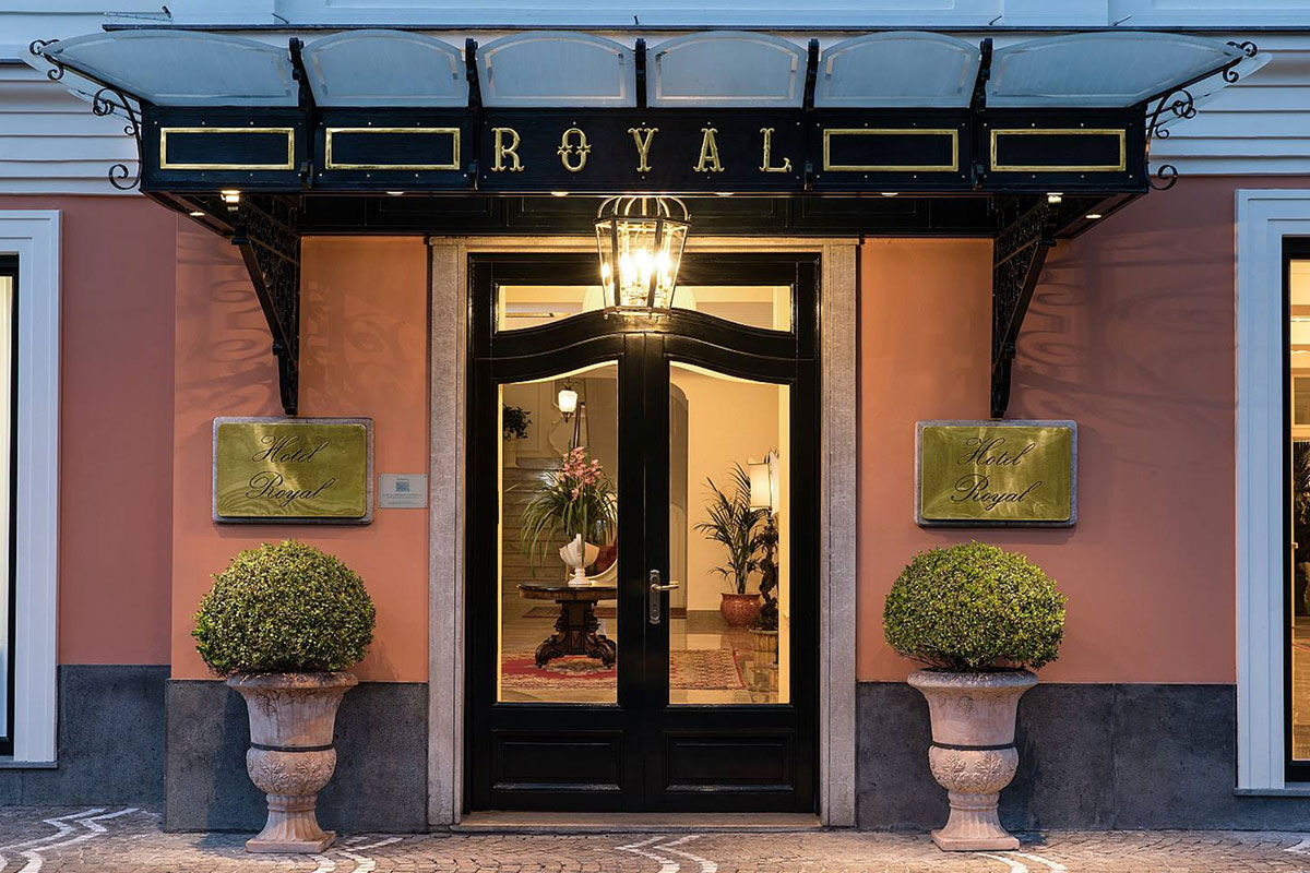 <b>Grand Hotel Royal, Sorrento</b> - Featuring a private beach on site, the Grand Hotel Royal is an elegant estate overlooking the Gulf of Naples from its perch on a cliff. Wander through the palm-filled gardens and smell the citrus trees at sunset before retreating to your suite which features contemporary-classic furnishings.