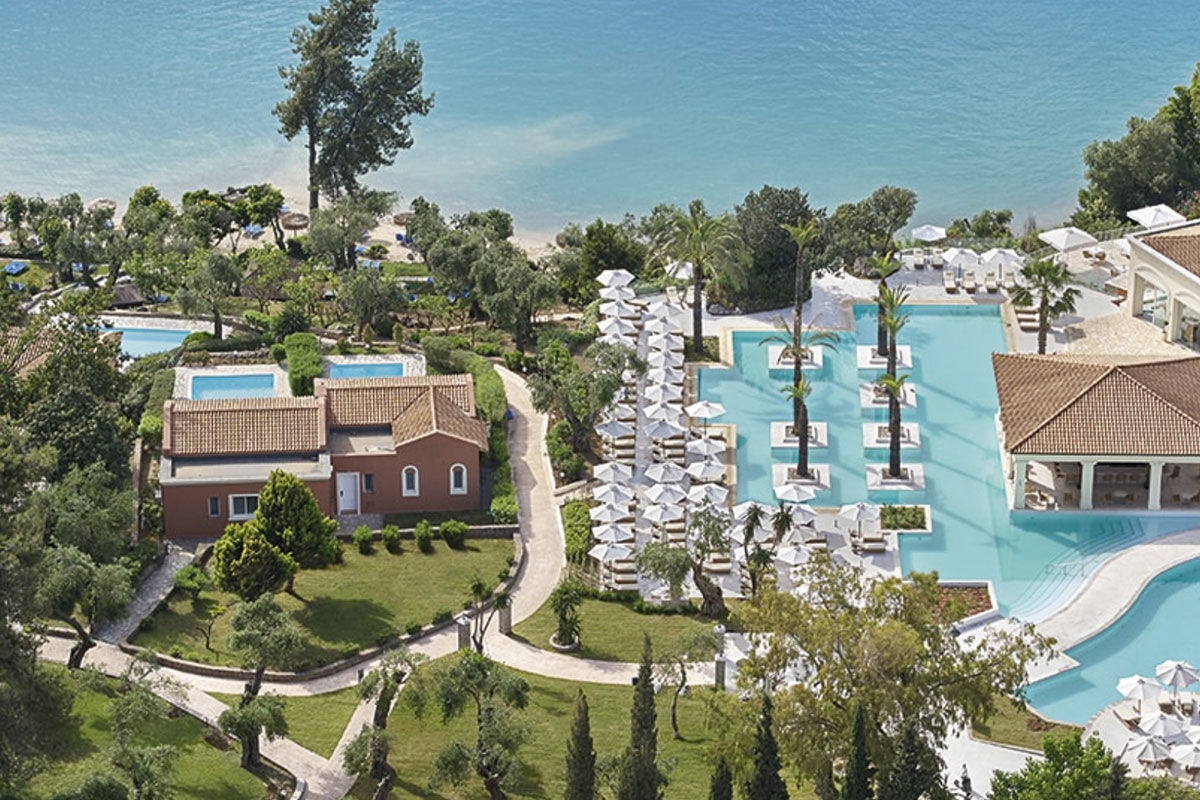 <b>Grecotel Eva Palace, Kommeno</b> - With a private beach and sweeping views of the Ionian Sea and Corfu Town, the Grecotel Eva Palace is a prime location for guests wanting luxury and glam. The rooms are bright, cheery and have an enchanting beach feel.