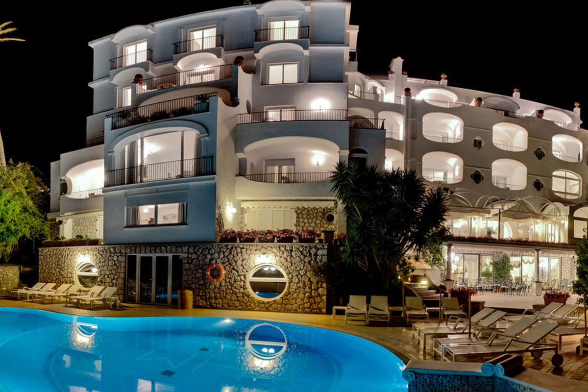 <b>Hotel Mamela, Capri</b> - Nearby to local sights, Hotel Mamela holds its upmarket feel with elegant rooms featuring marble or hand painted tiles and bright, unique furnishings. The pool and sundeck are frequented by guests and add to the glam-luxe feel in the middle of Capri.