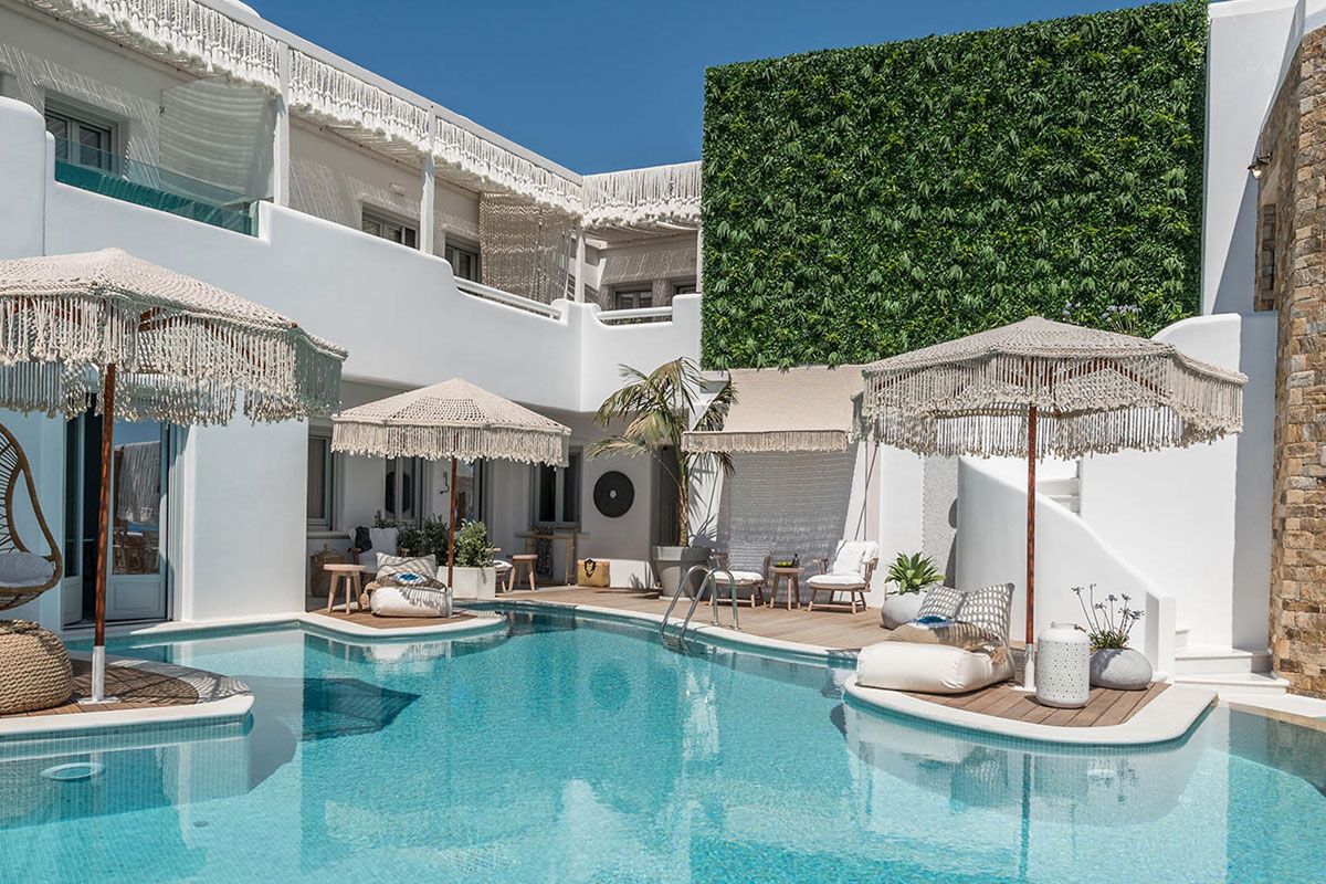<b>Virtu Suites, Agios Prokopios</b> - Steps from the sand of Agios Prokopios Beach, the Virtu Suites is luxurious living with a relaxed bohemian style. The poolside bar and restaurant have woven umbrellas, and the hanging chairs provide ample views of the sea.