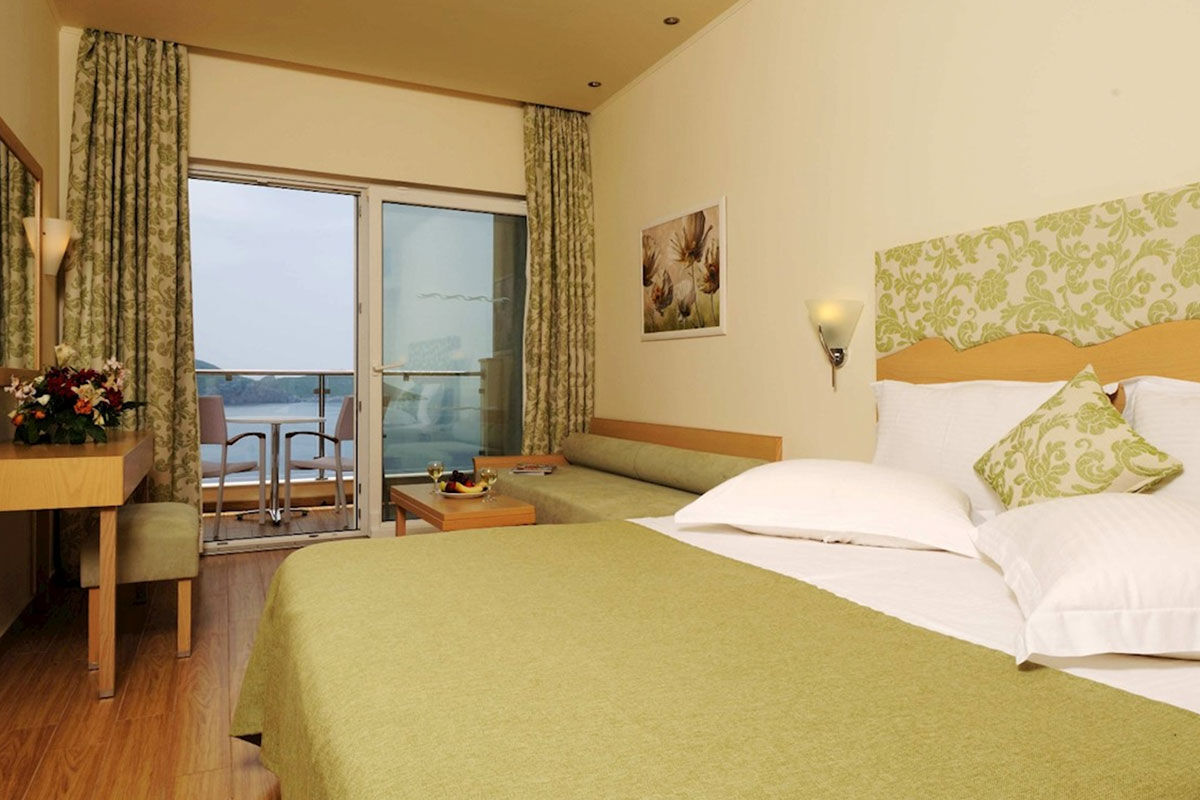 <b>Akrotiri Beach, Paleokastritsa</b> - Nestled into the cliff on the edge of the Alipa Marina, Akrotiri Beach Hotel hums with activity: guests relax at the sun terrace bar, swim in the infinity pool and pack their bathing suits for a trip to Agia Triada Beach.