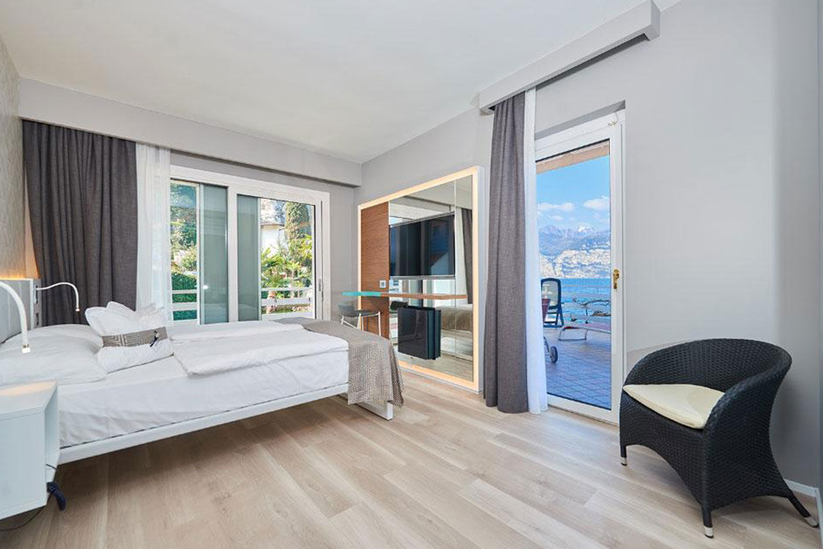 <b>Castello - Lake Front Hotel & Living Suites, Malcesine</b> - On the shores of Lake Garda, Hotel Castello is the perfect place to relax under a parasol on the private beach or dine on the lakefront terrace restaurant. It has an airy charm and is within walking distance of the historical alleyways downtown.