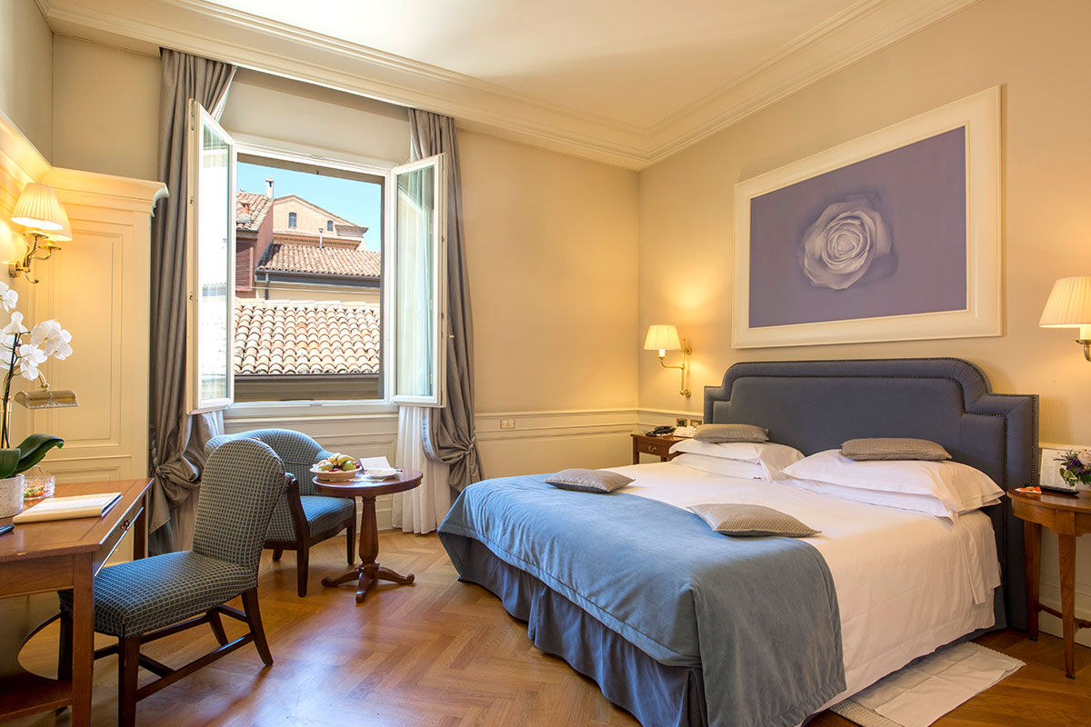 <b>Hotel Corona D'Oro, Bologna</b> - Housed in a 13th century redbrick building, this elegant hotel is a 3-minute walk from both St. Peter’s Cathedral and the medieval towers of Bologna. With its pillar-lined lounge and refined rooms, the Hotel Corona D’Oro takes this intimate property to a whole new level.