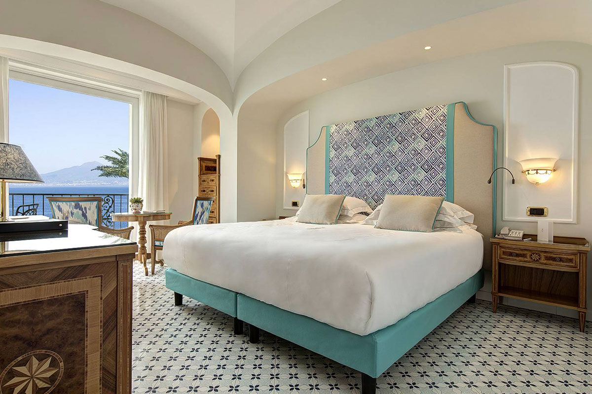 <b>Grand Hotel Royal, Sorrento</b> - Featuring a private beach on site, the Grand Hotel Royal is an elegant estate overlooking the Gulf of Naples from its perch on a cliff. Wander through the palm-filled gardens and smell the citrus trees at sunset before retreating to your suite which features contemporary-classic furnishings.