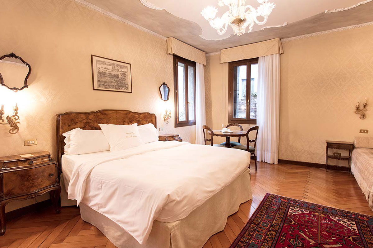 <b>Hotel Flora</b> - Covered in ivy and featuring traditional furnishings and chandeliers, Hotel Flora is a charming 17th century dream. Enjoy a peaceful breakfast in the leafy courtyard before heading to neighboring Saint Mark’s Square or Calle XXII Marzo for some upscale shopping.