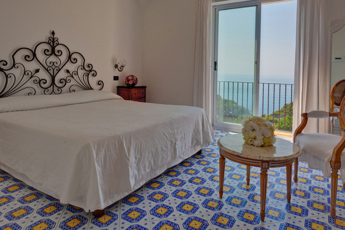 <b>Hotel Mamela, Capri</b> - Nearby to local sights, Hotel Mamela holds its upmarket feel with elegant rooms featuring marble or hand painted tiles and bright, unique furnishings. The pool and sundeck are frequented by guests and add to the glam-luxe feel in the middle of Capri.