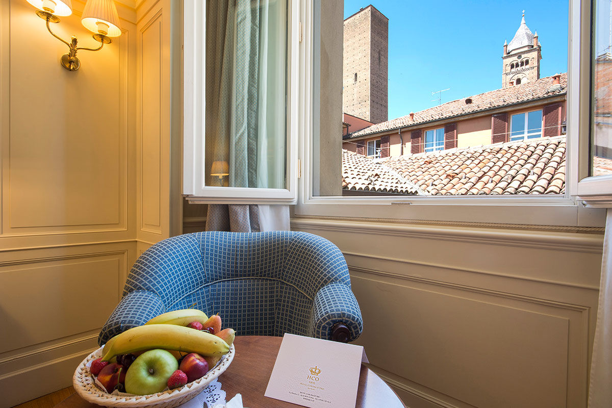 <b>Hotel Corona D'Oro, Bologna</b> - Housed in a 13th century redbrick building, this elegant hotel is a 3-minute walk from both St. Peter’s Cathedral and the medieval towers of Bologna. With its pillar-lined lounge and refined rooms, the Hotel Corona D’Oro takes this intimate property to a whole new level.