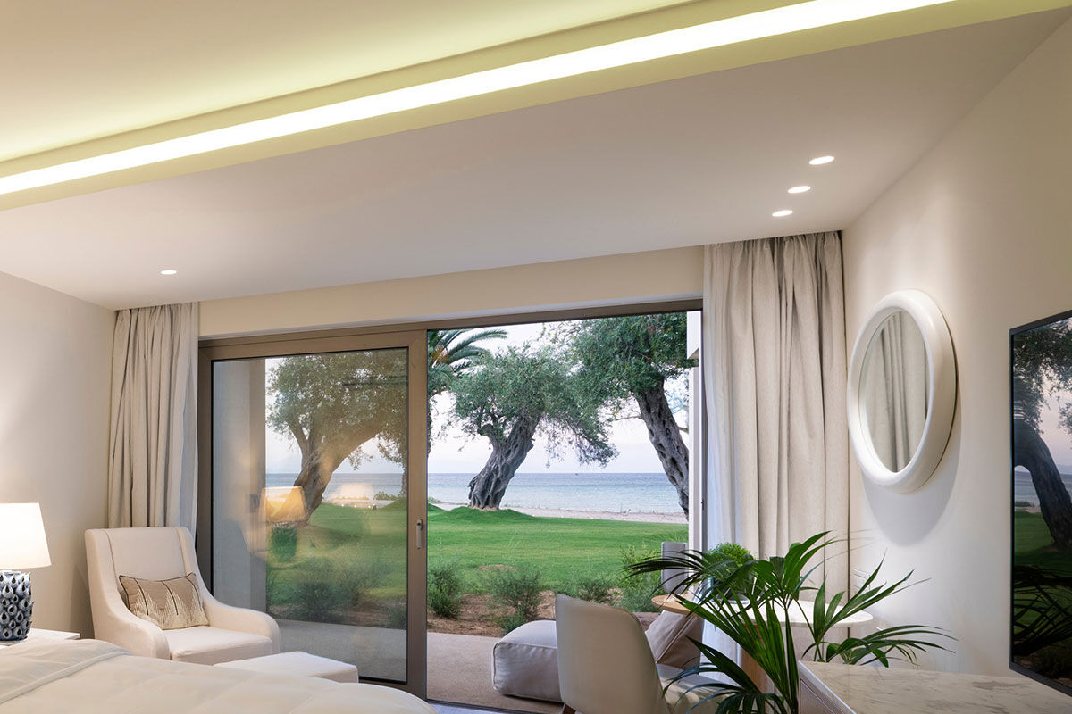 <b>Domes Miramare, a Luxury Collection Resort, Moraitika</b> - Walk along the private white sand beach before heading to the Blue Bar for some pre-dinner drinks at this refined adult-only resort. After that, head over to the raw bar or take a sunset dip in the infinity pool before retreating to your classic upscale room with a view.