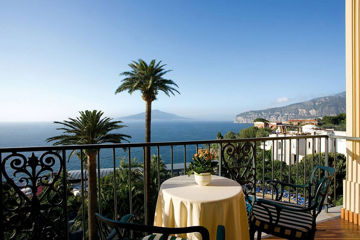 <b>Grand Hotel Royal, Sorrento</b> - Featuring a private beach on site, the Grand Hotel Royal is an elegant estate overlooking the Gulf of Naples from its perch on a cliff. Wander through the palm-filled gardens and smell the citrus trees at sunset before retreating to your suite which features contemporary-classic furnishings.