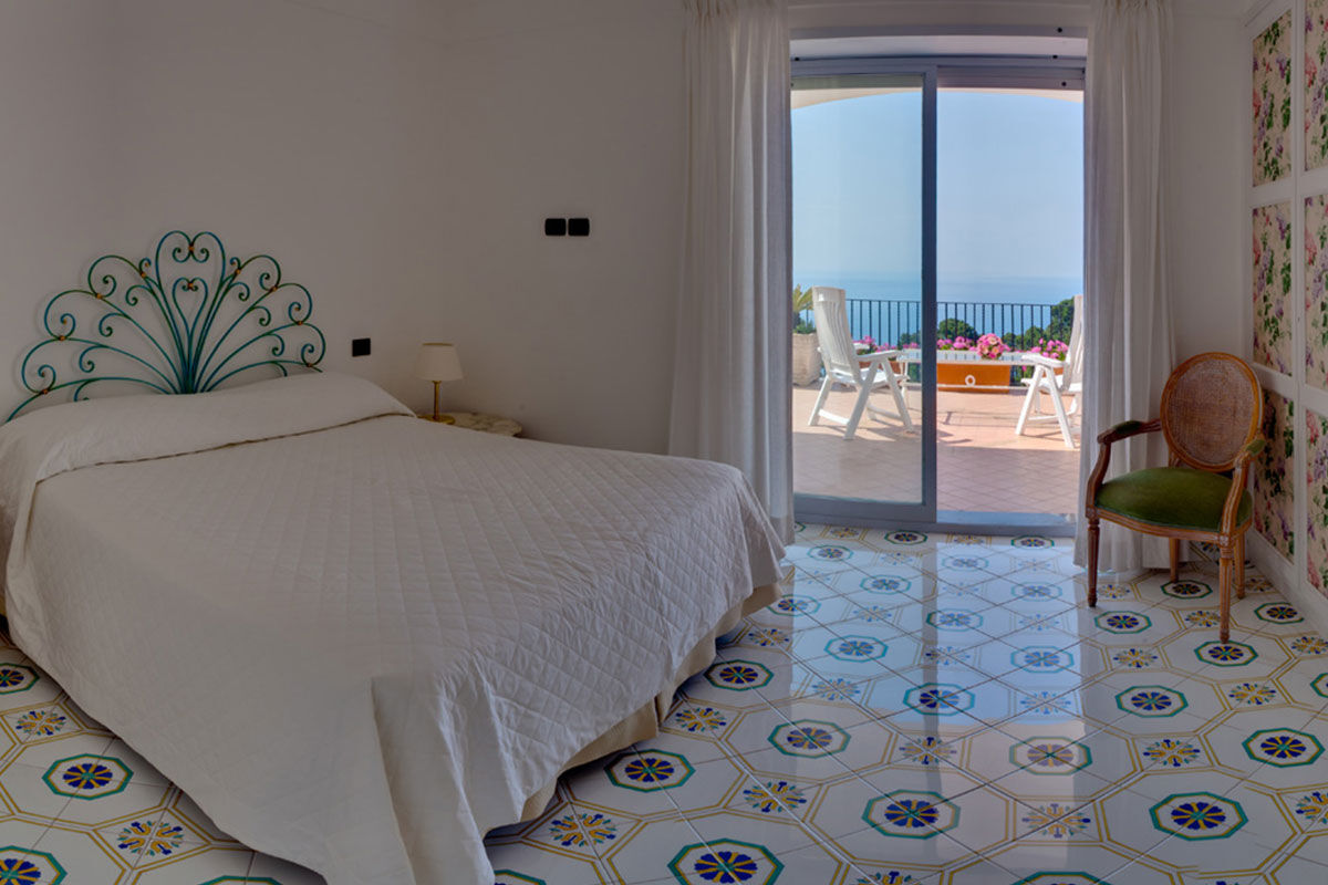 <b>Hotel Mamela, Capri</b> - Nearby to local sights, Hotel Mamela holds its upmarket feel with elegant rooms featuring marble or hand painted tiles and bright, unique furnishings. The pool and sundeck are frequented by guests and add to the glam-luxe feel in the middle of Capri.