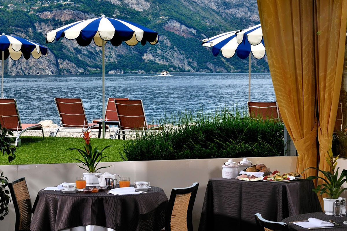 <b>Castello - Lake Front Hotel & Living Suites, Malcesine</b> - On the shores of Lake Garda, Hotel Castello is the perfect place to relax under a parasol on the private beach or dine on the lakefront terrace restaurant. It has an airy charm and is within walking distance of the historical alleyways downtown.