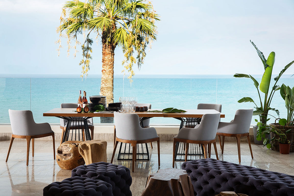 <b>Domes Miramare, a Luxury Collection Resort, Moraitika</b> - Walk along the private white sand beach before heading to the Blue Bar for some pre-dinner drinks at this refined adult-only resort. After that, head over to the raw bar or take a sunset dip in the infinity pool before retreating to your classic upscale room with a view.