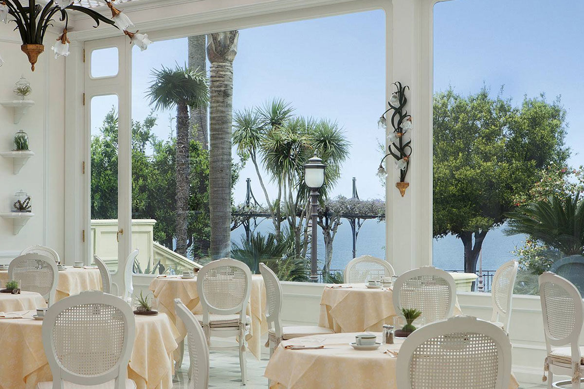 <b>Grand Hotel Royal, Sorrento</b> - Featuring a private beach on site, the Grand Hotel Royal is an elegant estate overlooking the Gulf of Naples from its perch on a cliff. Wander through the palm-filled gardens and smell the citrus trees at sunset before retreating to your suite which features contemporary-classic furnishings.