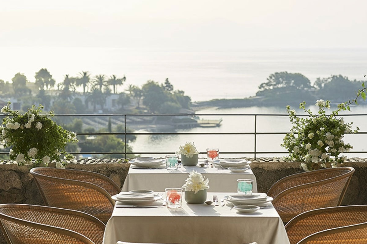<b>Grecotel Eva Palace, Kommeno</b> - With a private beach and sweeping views of the Ionian Sea and Corfu Town, the Grecotel Eva Palace is a prime location for guests wanting luxury and glam. The rooms are bright, cheery and have an enchanting beach feel.