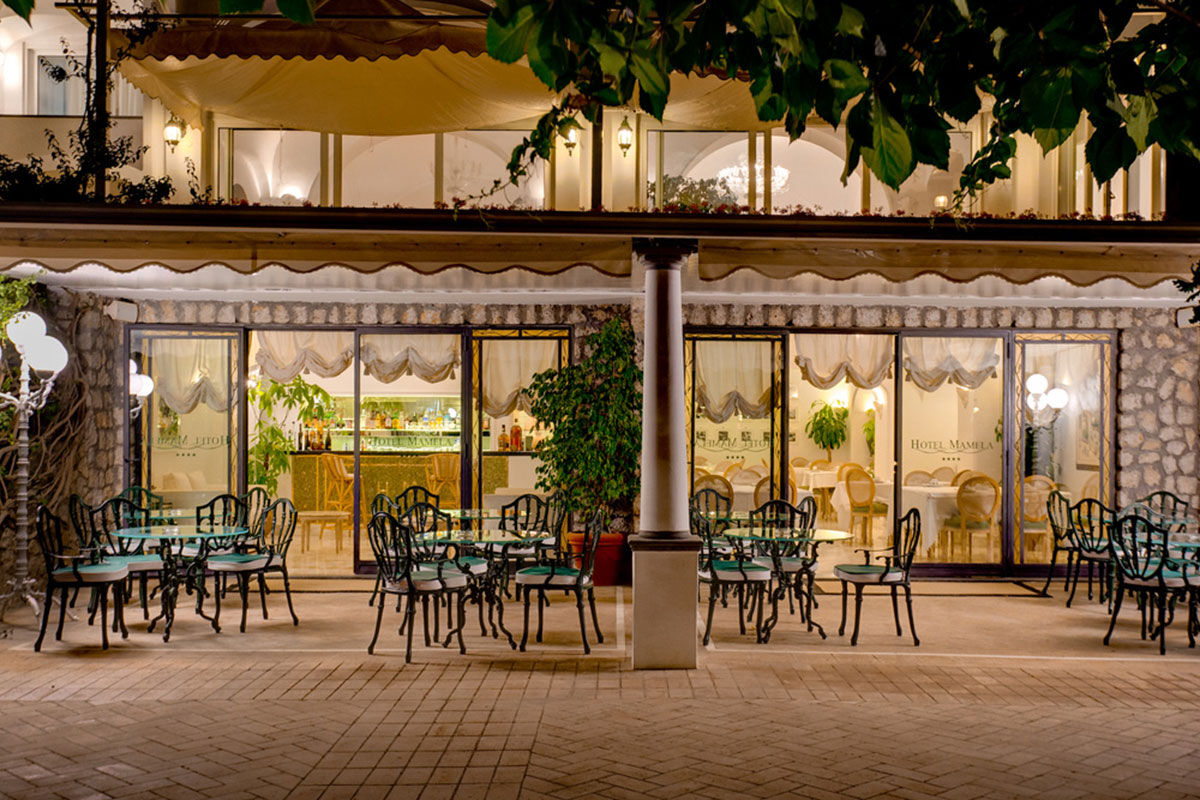 <b>Hotel Mamela, Capri</b> - Nearby to local sights, Hotel Mamela holds its upmarket feel with elegant rooms featuring marble or hand painted tiles and bright, unique furnishings. The pool and sundeck are frequented by guests and add to the glam-luxe feel in the middle of Capri.