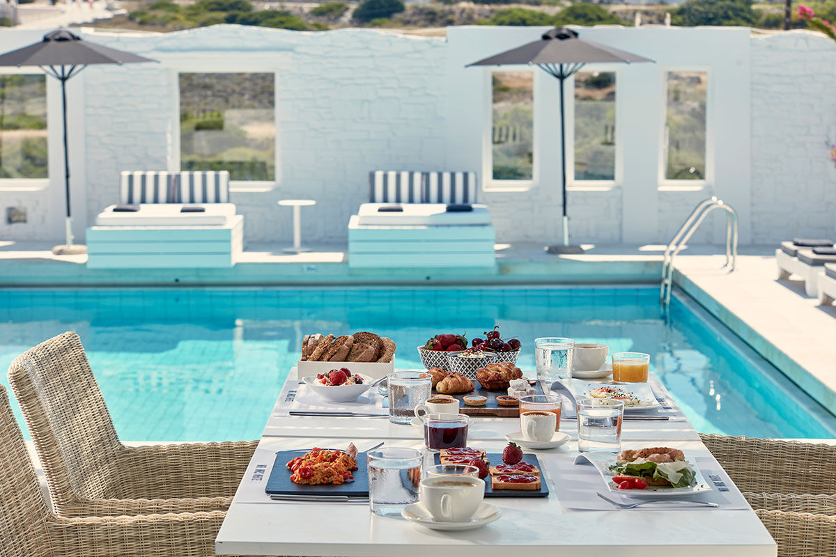 <b>Mr & Mrs White, Naoussa</b> - With clean lines, whitewashed stone, and contemporary boho details, Mr. & Mrs. White charms guests upon arrival. With two pools and only a stone’s throw away from Naoussa, laid back luxury is this boutique hotel’s specialty.