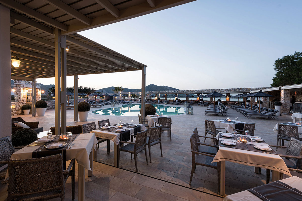 <b>Saint Andrea Seaside Resort, Naoussa</b> - Comprised of traditional Cycladic buildings centered around a sleek aquamarine pool, the Saint Andrea Seaside Resort is welcoming with a country-chic décor. With indoor and outdoor bars, stone alleyways and Mediterranean shrubbery blooming throughout the property, you’ll never want to leave.