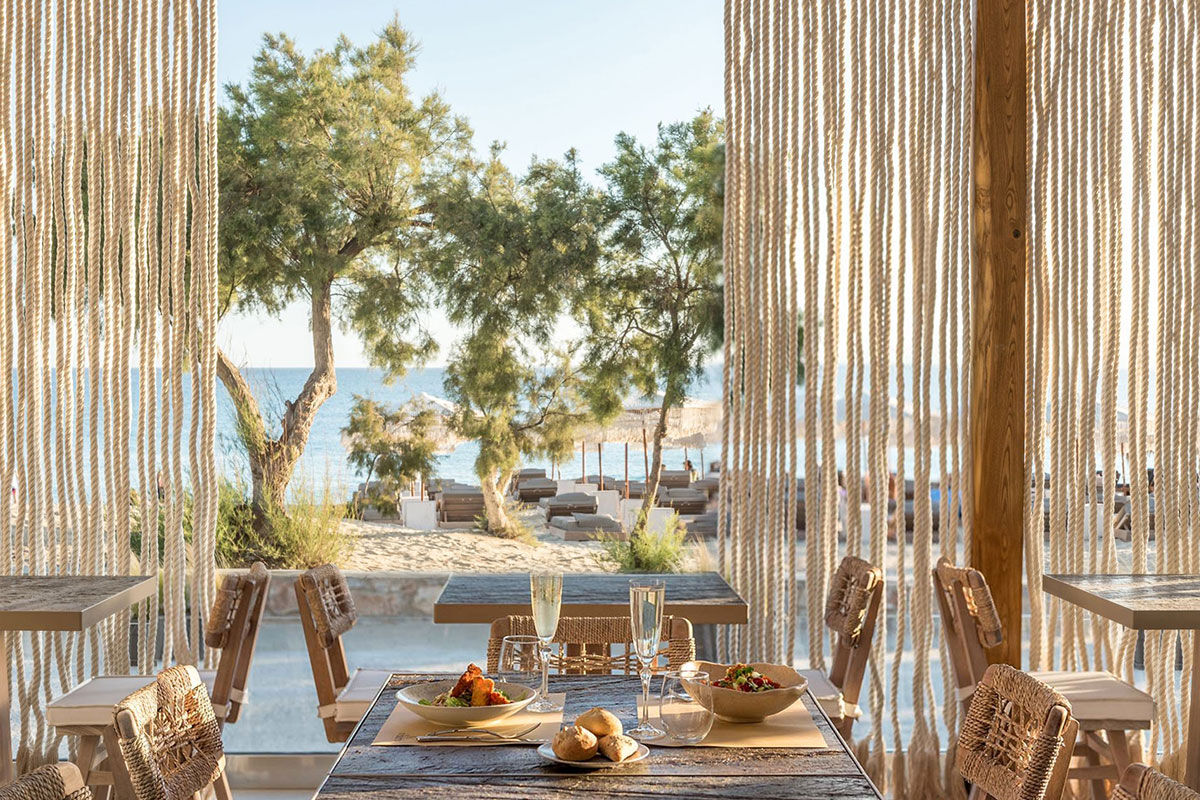 <b>Virtu Suites, Agios Prokopios</b> - Steps from the sand of Agios Prokopios Beach, the Virtu Suites is luxurious living with a relaxed bohemian style. The poolside bar and restaurant have woven umbrellas, and the hanging chairs provide ample views of the sea.
