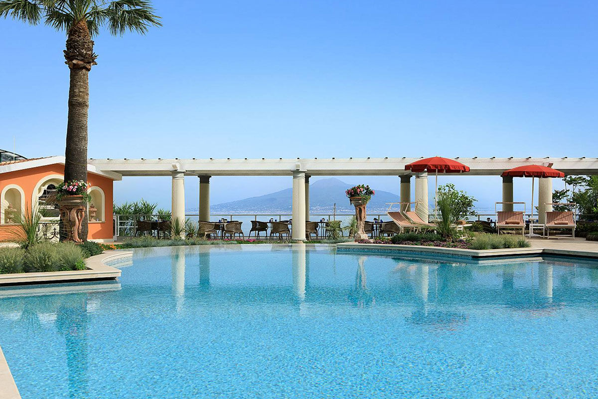 <b>Grand Hotel Royal, Sorrento</b> - Featuring a private beach on site, the Grand Hotel Royal is an elegant estate overlooking the Gulf of Naples from its perch on a cliff. Wander through the palm-filled gardens and smell the citrus trees at sunset before retreating to your suite which features contemporary-classic furnishings.