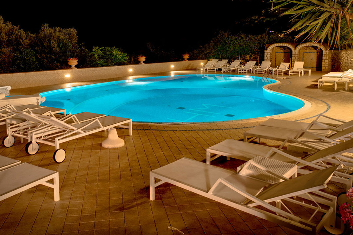 <b>Hotel Mamela, Capri</b> - Nearby to local sights, Hotel Mamela holds its upmarket feel with elegant rooms featuring marble or hand painted tiles and bright, unique furnishings. The pool and sundeck are frequented by guests and add to the glam-luxe feel in the middle of Capri.