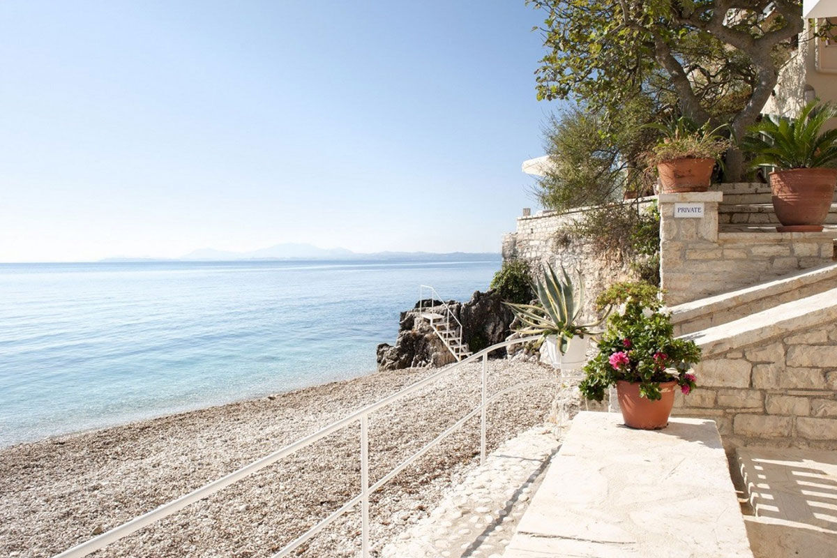 <b>Kaminaki Villas, Nissaki</b> - Conveniently located steps away from the pebble beach that bares the same name, the Kaminaki Villas have a cozy feel that welcomes guests upon arrival. This home-away-from-home has a terrace, pool and outdoor dining area where you can prepare a homemade meal for your family.