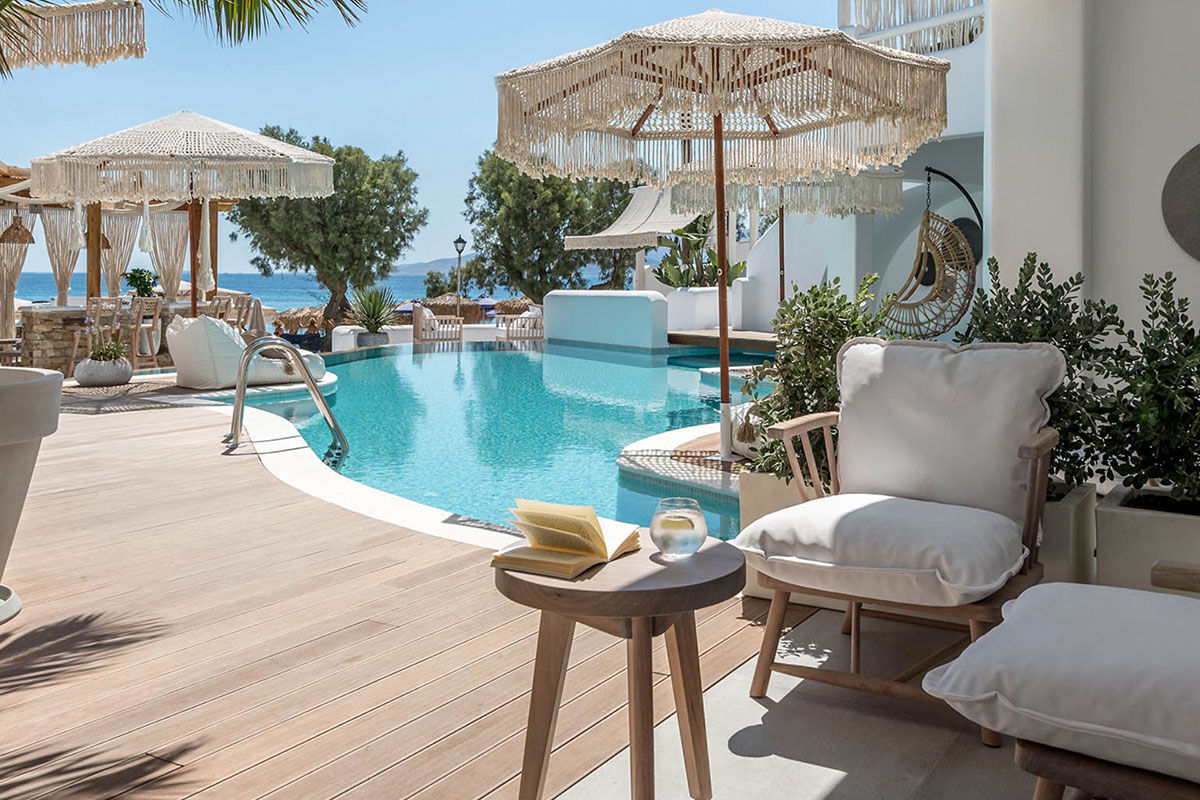 <b>Virtu Suites, Agios Prokopios</b> - Steps from the sand of Agios Prokopios Beach, the Virtu Suites is luxurious living with a relaxed bohemian style. The poolside bar and restaurant have woven umbrellas, and the hanging chairs provide ample views of the sea.