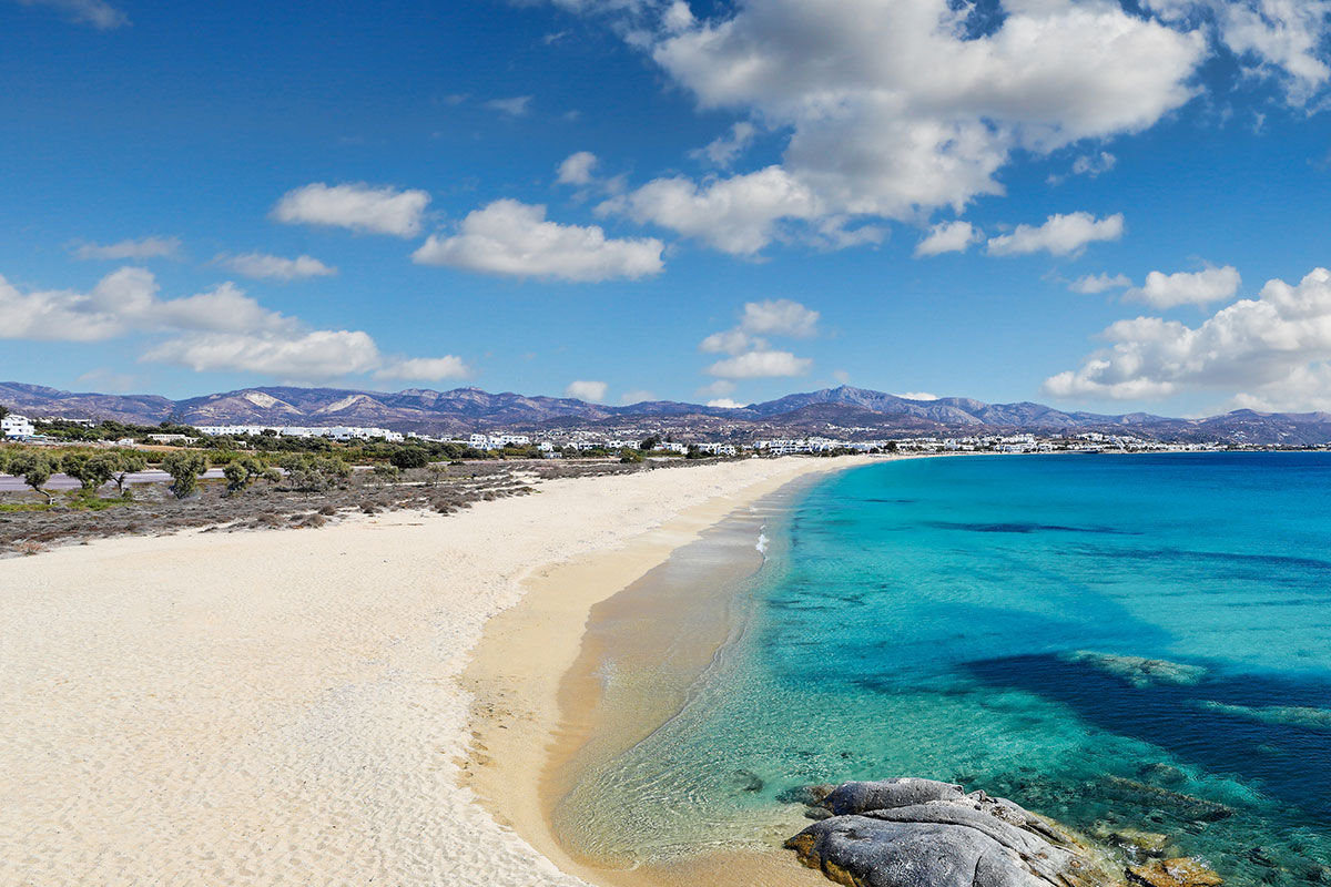<b>18 Grapes, Agios Prokopios</b> – Within walking distance to Agios Prokopios beach, the 18 Grapes Hotel hints of Cycladic features amidst comfortable design. With a care-free island vibe, yet an attention to detail, this modern resort has everything you need: a two-level pool with lounge decks, sophisticated roof terrace, and the Grape Sunset bar restaurant.