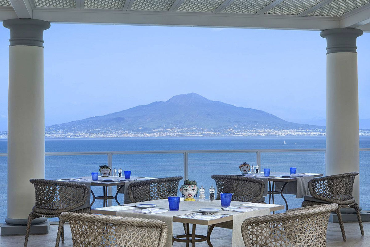 <b>Grand Hotel Royal, Sorrento</b> - Featuring a private beach on site, the Grand Hotel Royal is an elegant estate overlooking the Gulf of Naples from its perch on a cliff. Wander through the palm-filled gardens and smell the citrus trees at sunset before retreating to your suite which features contemporary-classic furnishings.