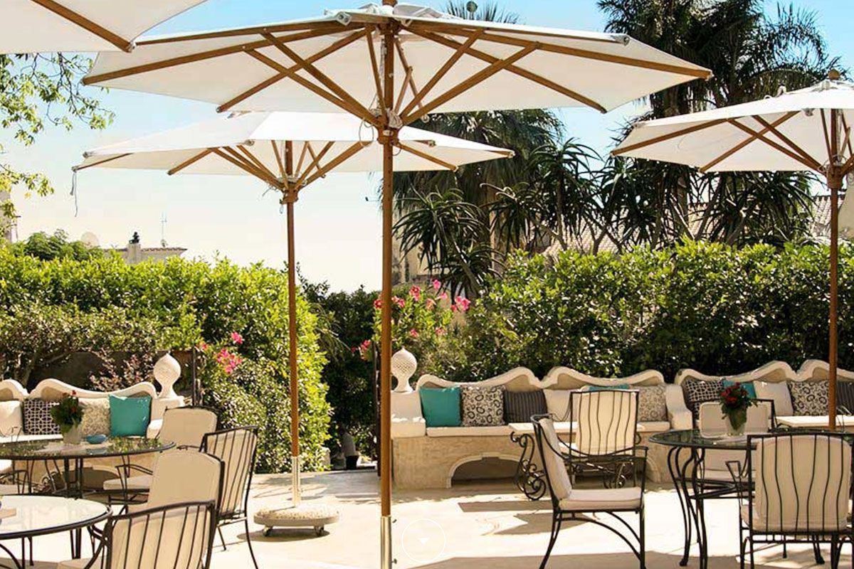 <b>Palazzo Murat, Positano</b> - A patrician residence with a secret garden to explore, this 18th century palazzo serves as an oasis right in the center of Positano. Palazzo Murat has a certain glamorous charm with its shaded terraces, canvas parasols, and sun loungers by the pool.