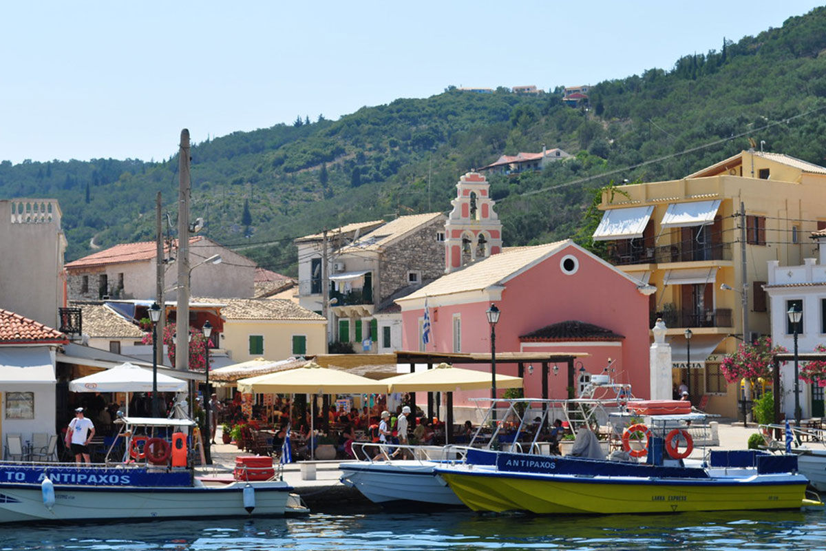 <b>Paxos Club Resort & Spa, Gaios</b> - Only a 15-minute walk to both the lively town and the ancient Cistern of Gaios, the Paxos Club Resort & Spa is conveniently located while remaining secluded and hidden by lush greenery. The rooms are simple and homey, the restaurant has an old-world feel with its stone wall and wooden beamed ceilings, and the pool has sun loungers with parasols.