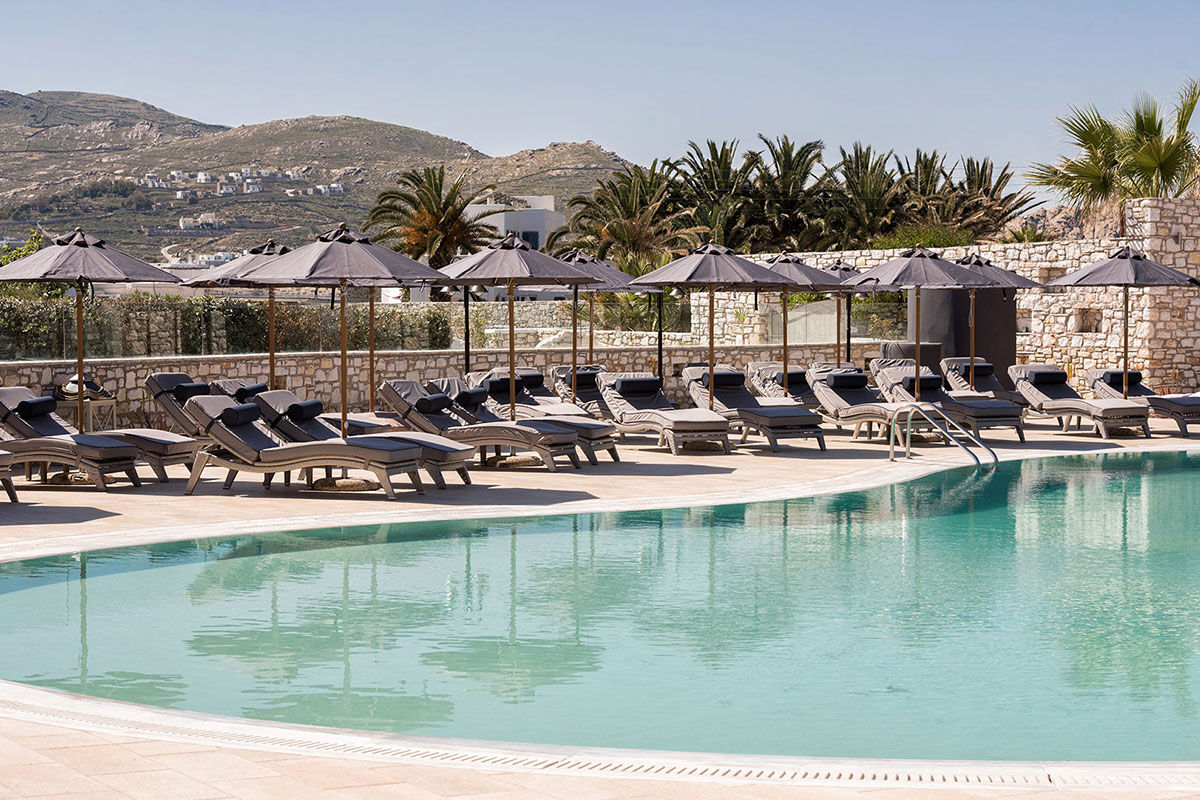 <b>Saint Andrea Seaside Resort, Naoussa</b> - Comprised of traditional Cycladic buildings centered around a sleek aquamarine pool, the Saint Andrea Seaside Resort is welcoming with a country-chic décor. With indoor and outdoor bars, stone alleyways and Mediterranean shrubbery blooming throughout the property, you’ll never want to leave.