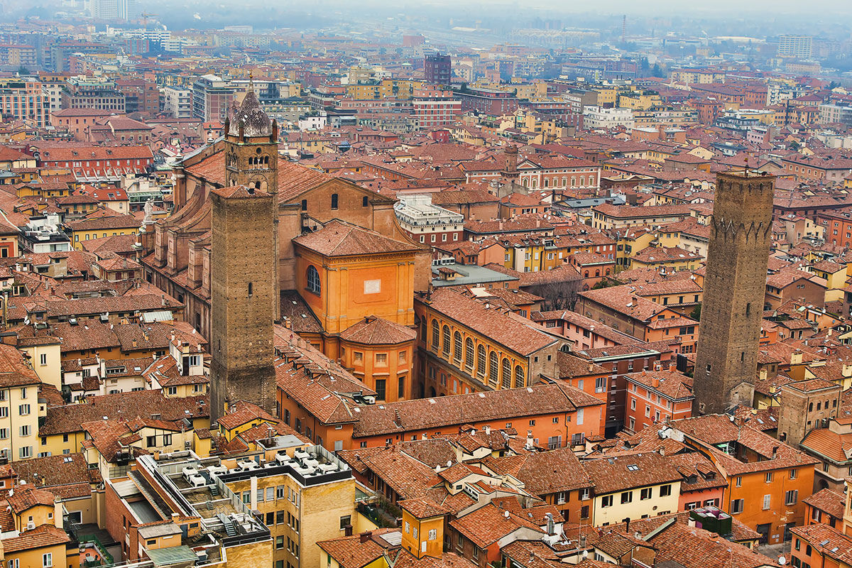 <b>Hotel Corona D'Oro, Bologna</b> - Housed in a 13th century redbrick building, this elegant hotel is a 3-minute walk from both St. Peter’s Cathedral and the medieval towers of Bologna. With its pillar-lined lounge and refined rooms, the Hotel Corona D’Oro takes this intimate property to a whole new level.