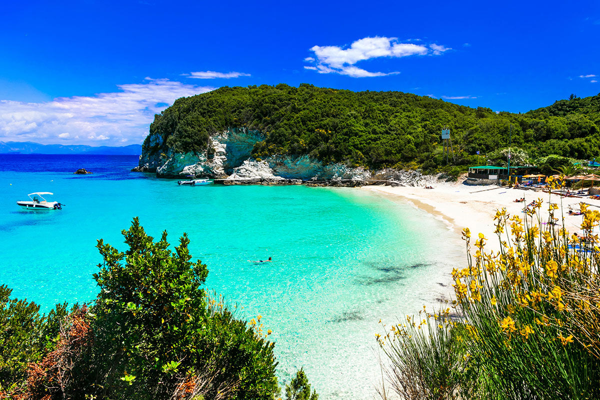 <b>Paxos Club Resort & Spa, Gaios</b> - Only a 15-minute walk to both the lively town and the ancient Cistern of Gaios, the Paxos Club Resort & Spa is conveniently located while remaining secluded and hidden by lush greenery. The rooms are simple and homey, the restaurant has an old-world feel with its stone wall and wooden beamed ceilings, and the pool has sun loungers with parasols.